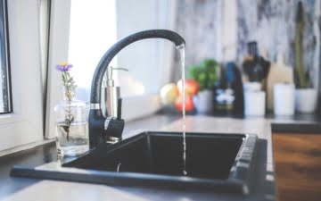 running faucet in the kitchen