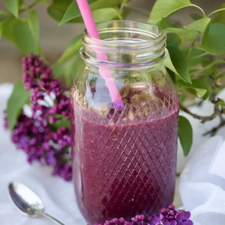 A jar of blueberry smoothie
