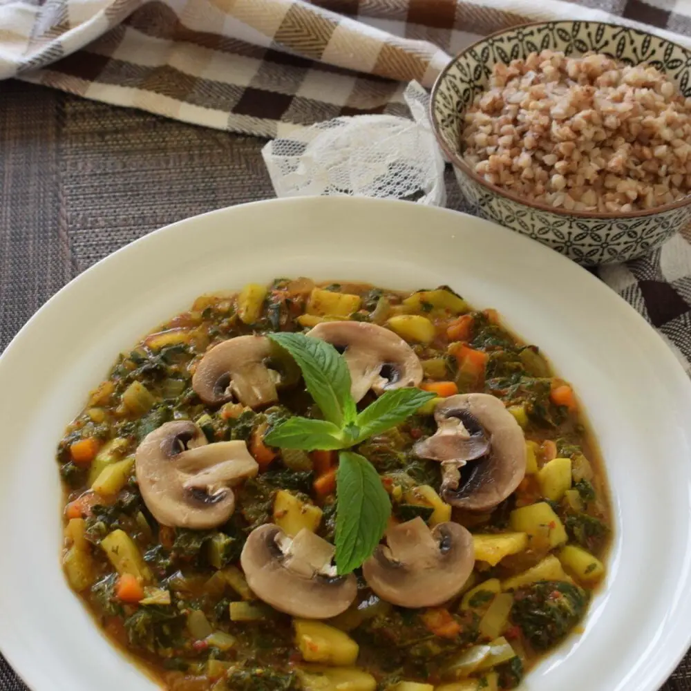 ¾view of a plate full of ginger turmeric nettle stew