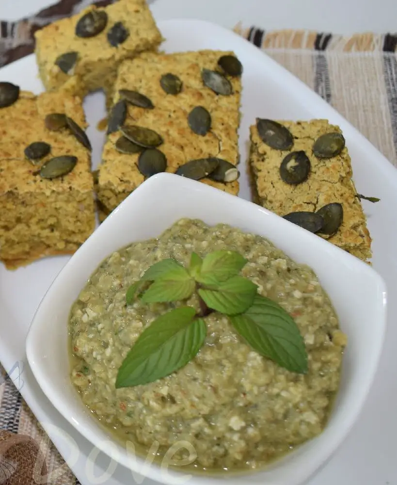 a ¾ shot of a bowl full of eggplant dip