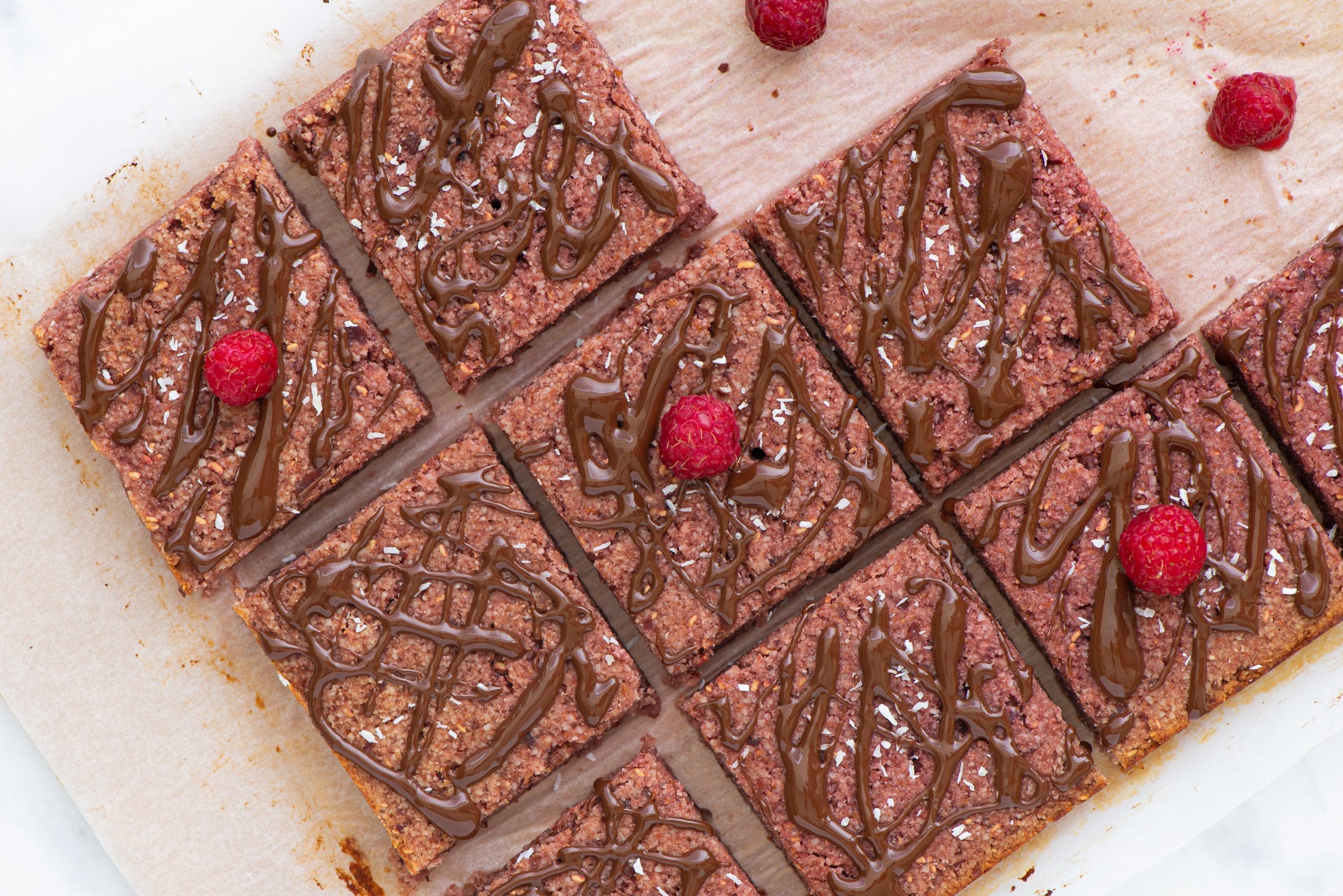 Almond and raspberry snack bars cut into squares