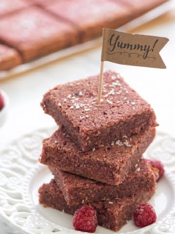 An easy and quick plant-based recipe that is 100% vegan and oil-free! Only whole food ingredients are used! These almond raspberry snack bars are super healthy and chewy. Raw almonds are combined with fresh raspberries and coconut flour, sweetened with dates for a complete taste sensation!