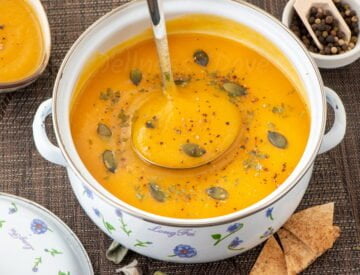 ¾ photo of a pot full of sweet potato parsnip soup