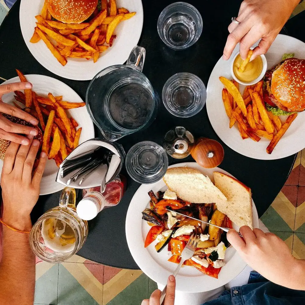 overhead photo of people eating burgers