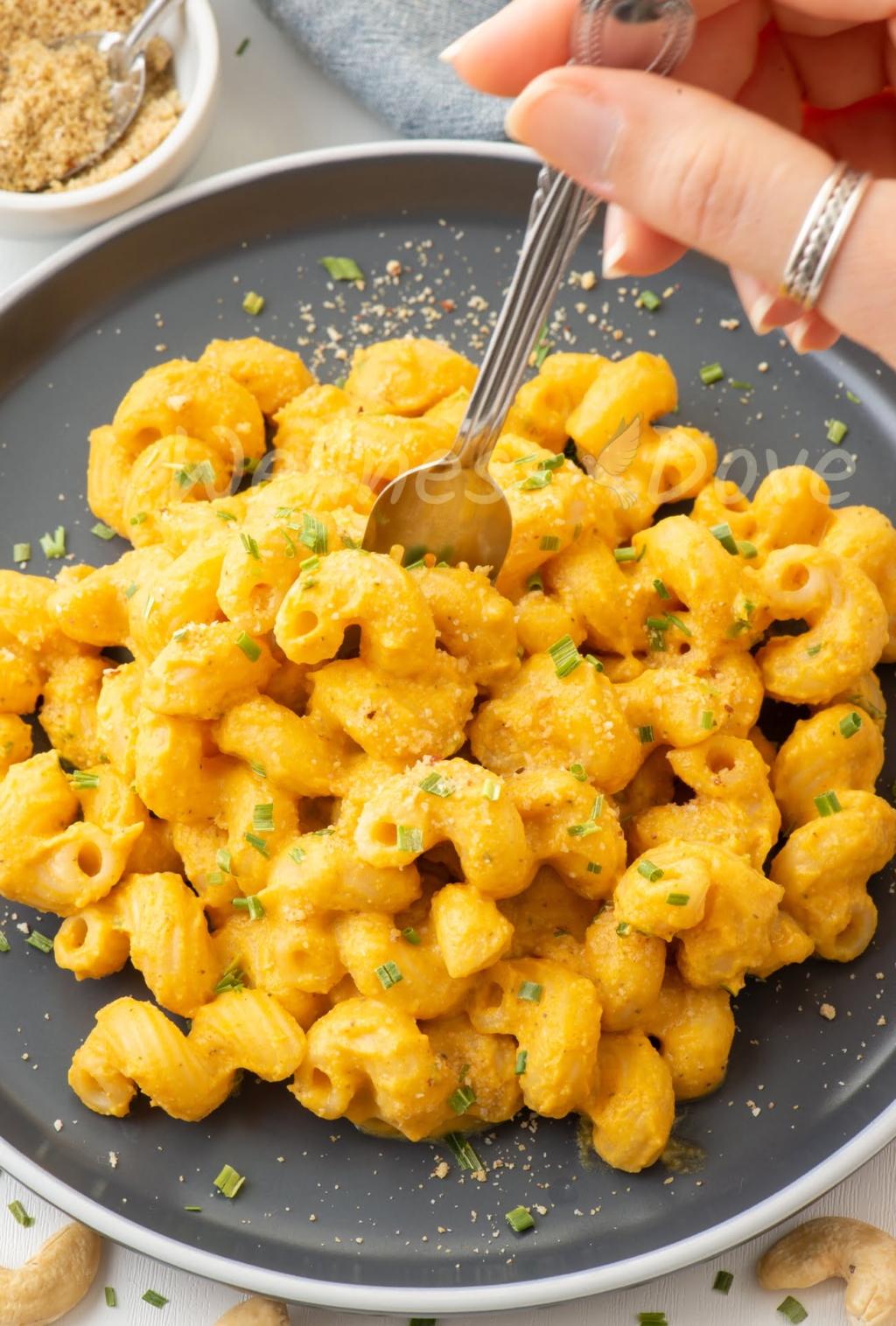 a round plate with vegan mac and cheese