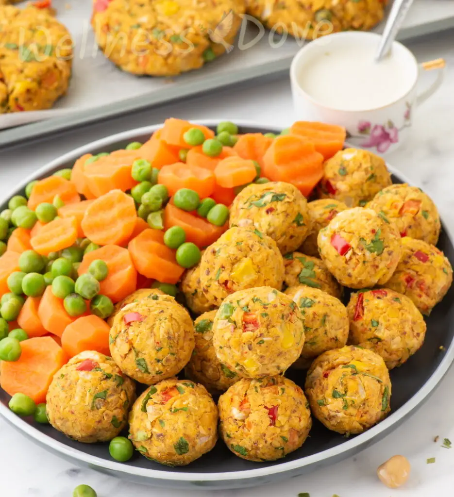 a plate with gluten free vegan chickpea balls and veggetables
