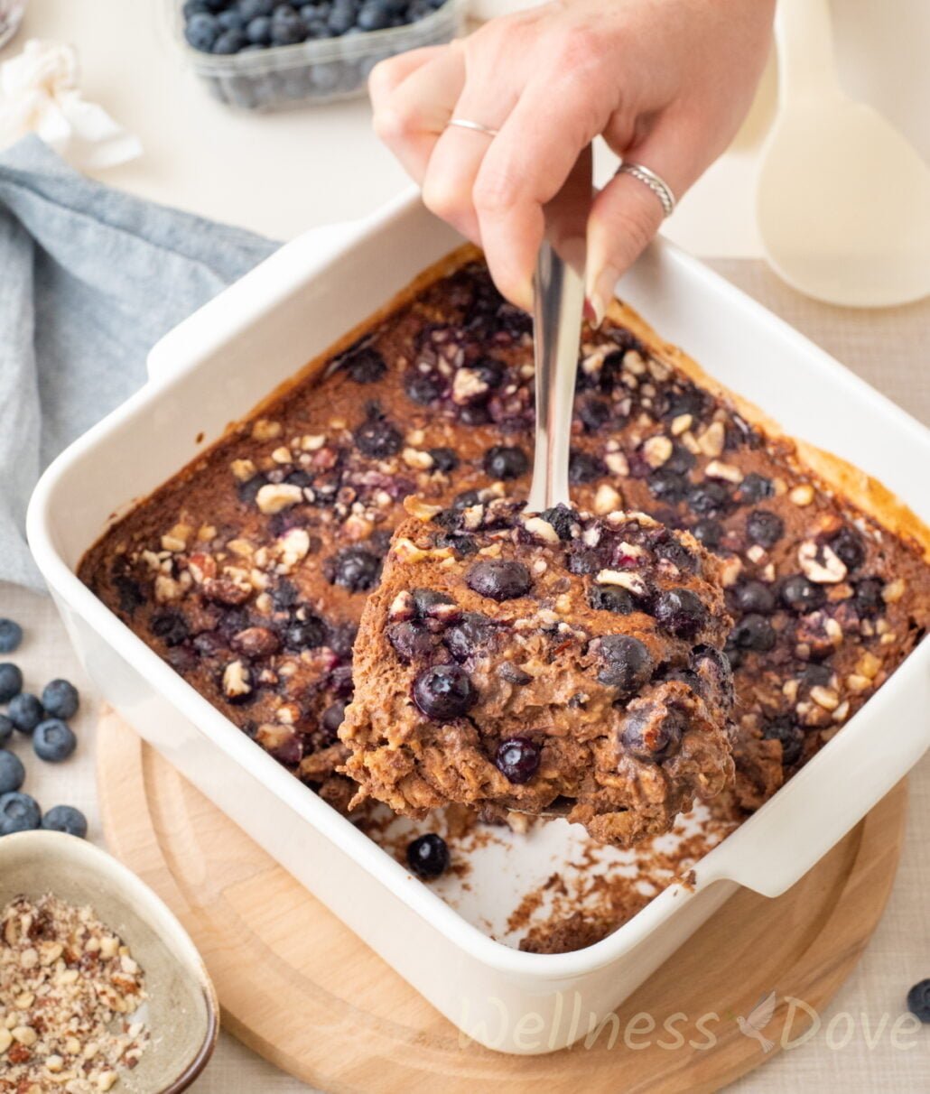 a spatula taking a big piece of ovenbaked oatmeal