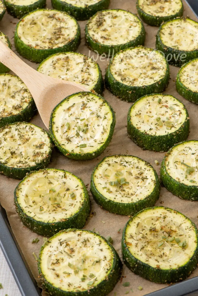 a 3/4 view of a baking pan with roasted zucchini vegan