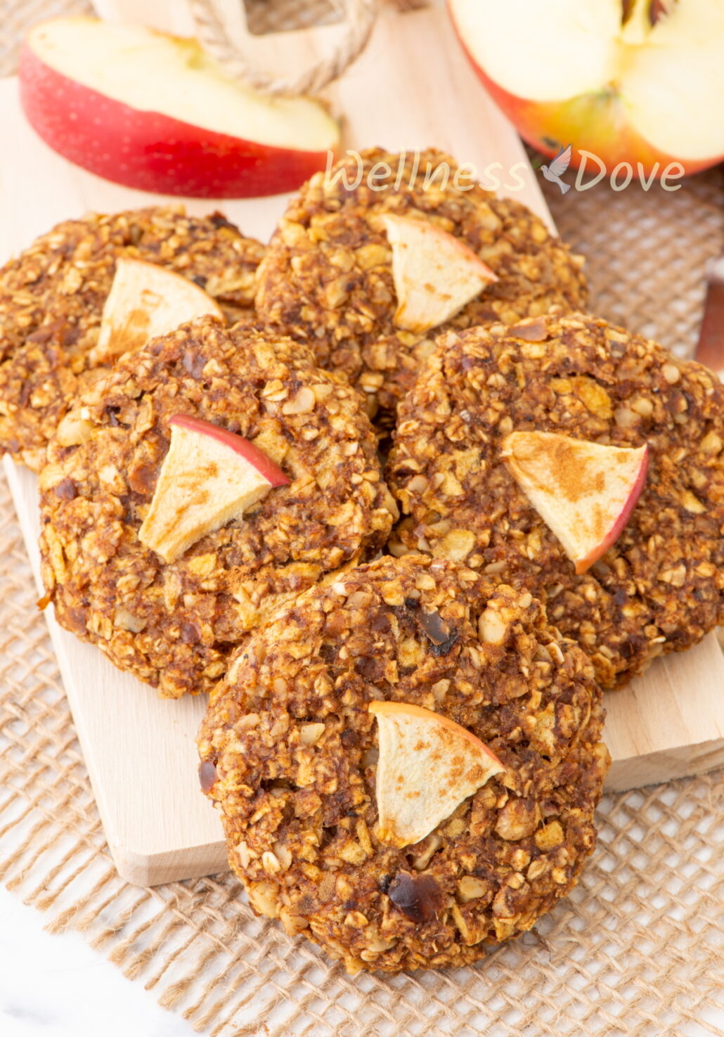 5 Apple Oatmeal Vegan Breakfast Cookies on a small chopping board.
