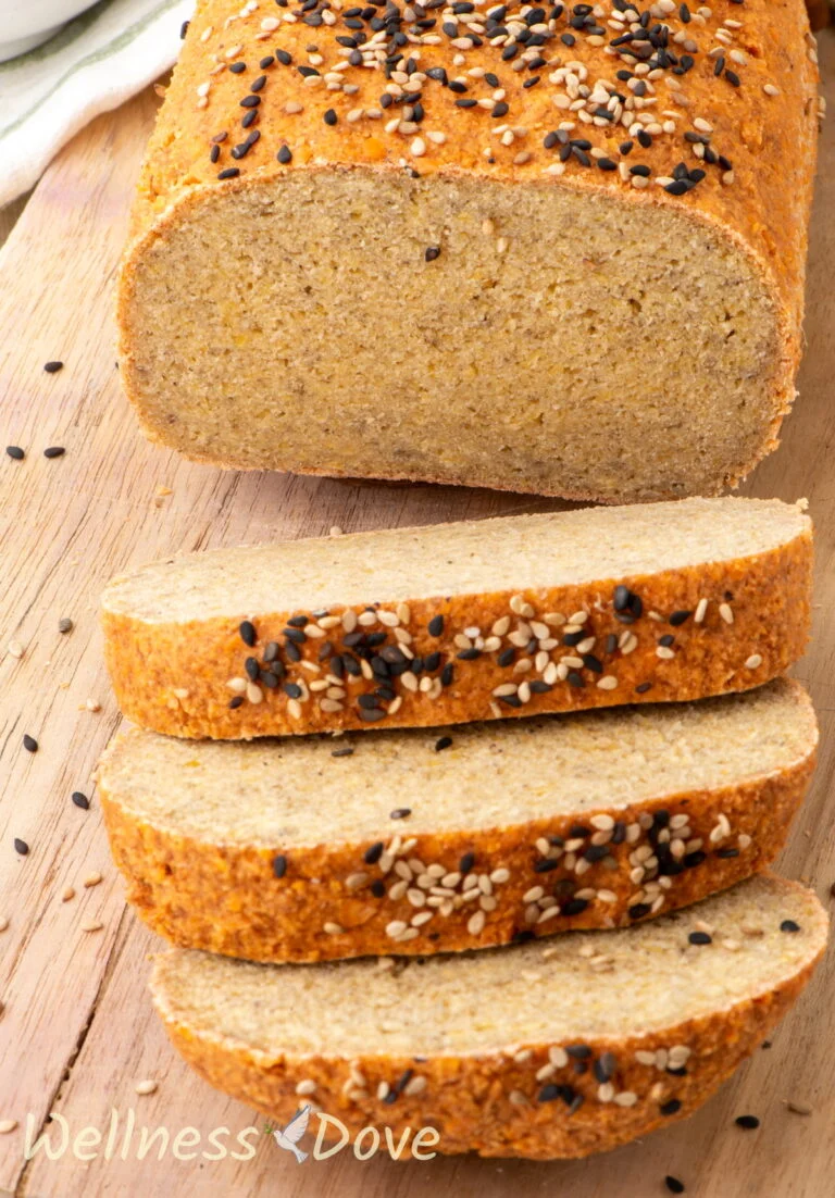 the vegan gluten free lentil bread. sliced on a chopping board, 3/4 view