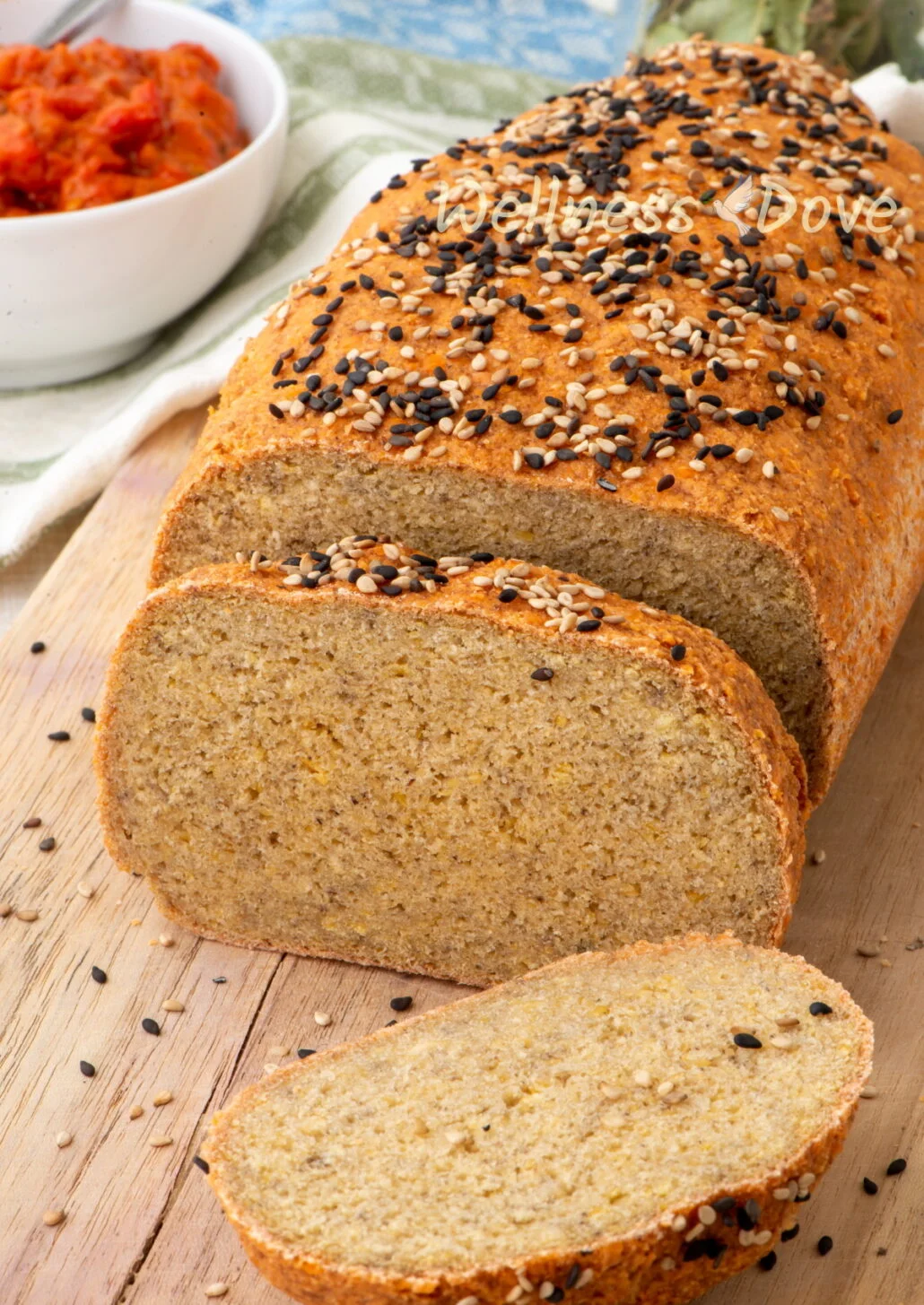 the load of vegan gluten free lentil bread on a chopping board, sliced 