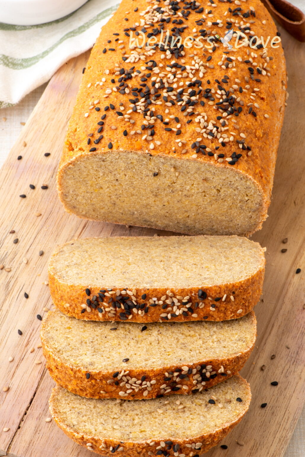 3 slices of the vegan gluten free lentil bread in front of the whole loaf