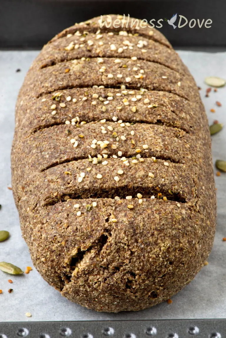 a close up photo of the vegan gluten free seeds bread in a baking tray