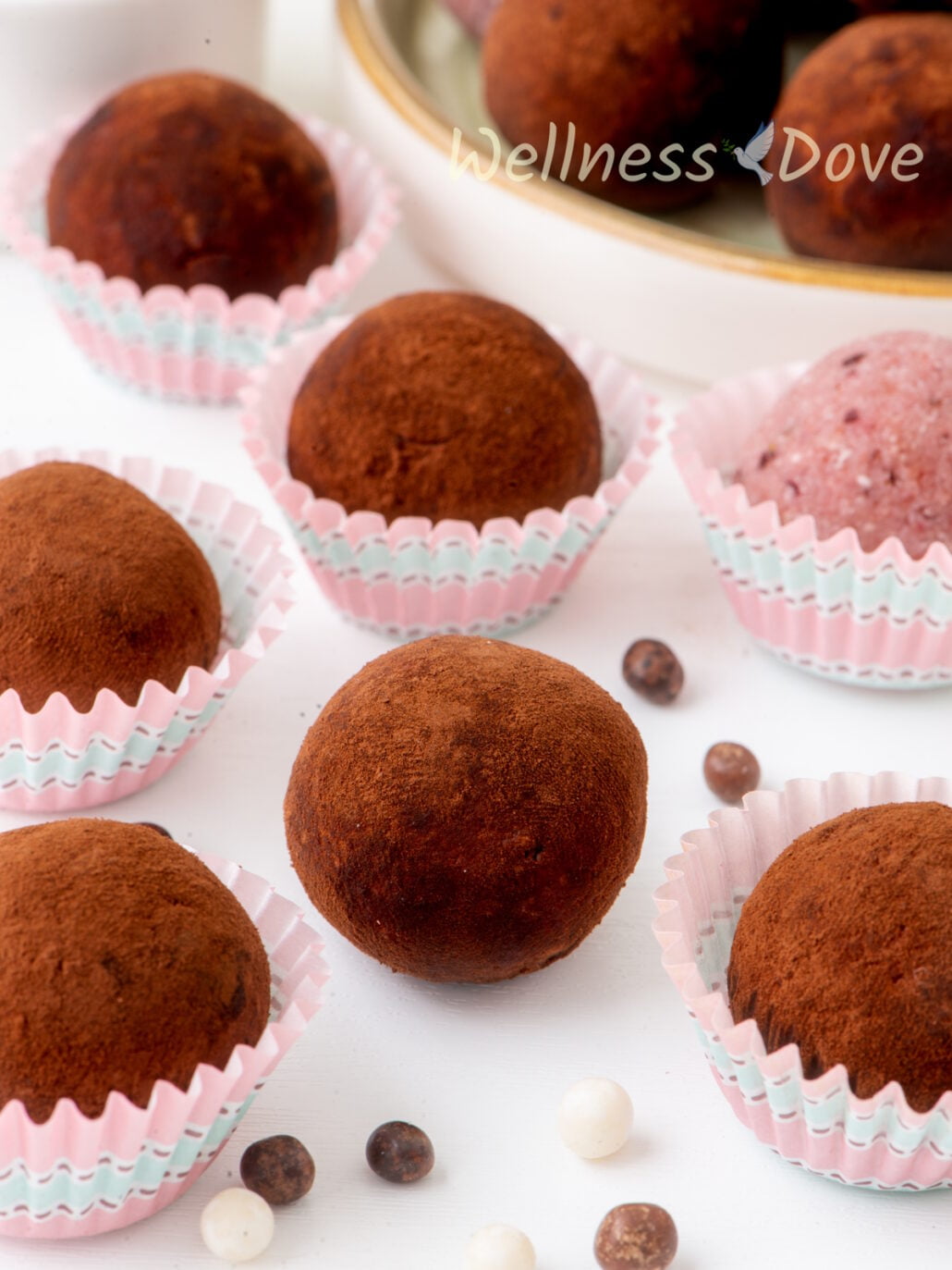 the strawberry vegan truffles on a table , close up view