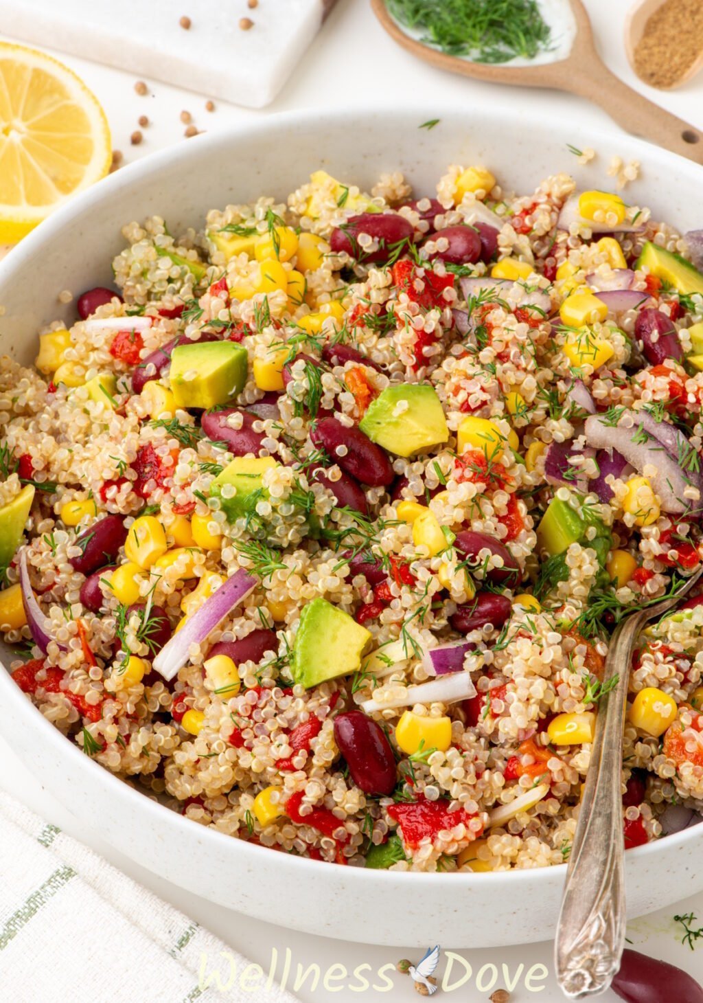 the vegan avocado quinoa salad in a large bowl - 3/4 angle