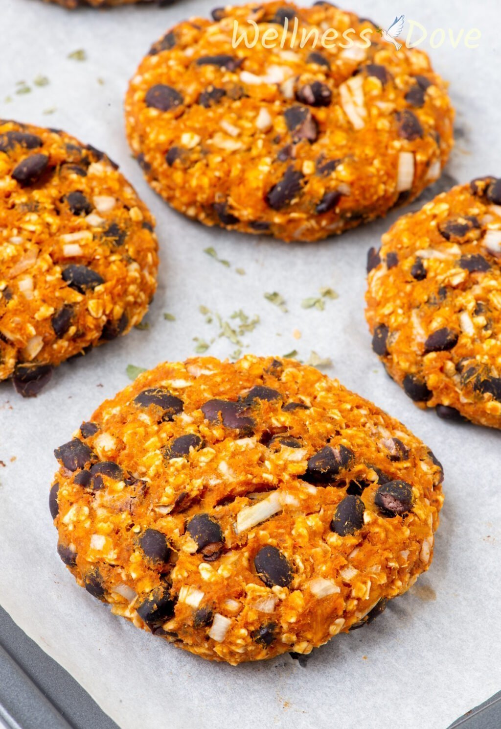 a very macro shot of some of the Sweet Potato Black Bean Burgers in a baking tray