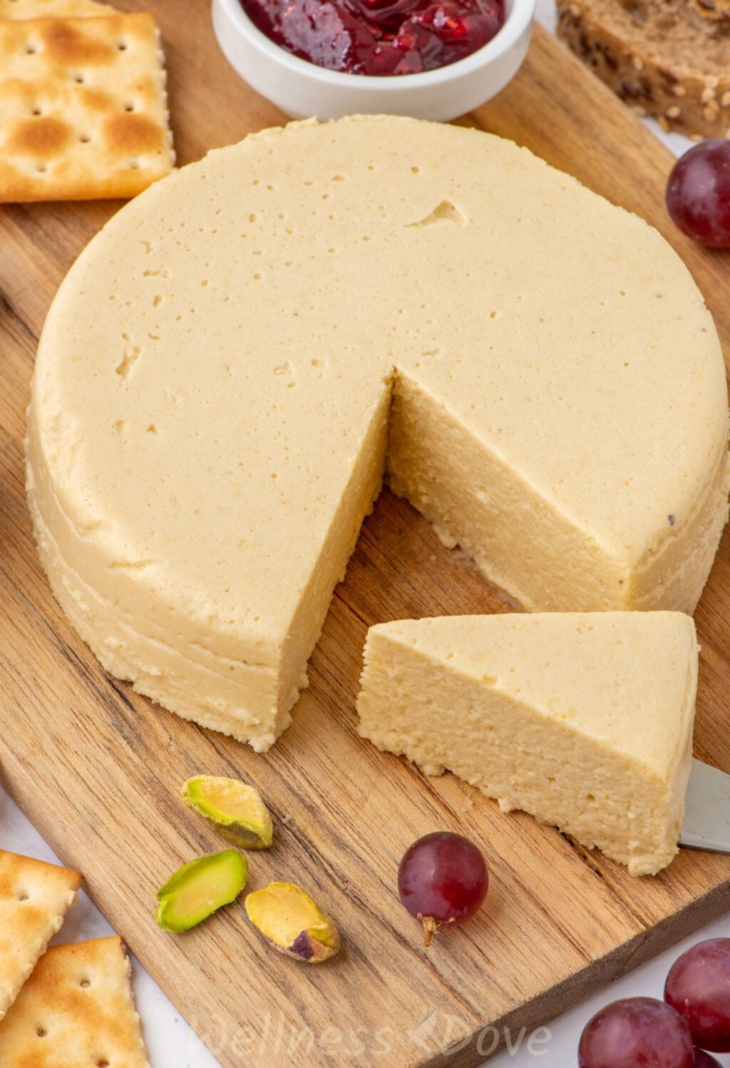 another shot of the Vegan Cashew Cheese on a chopping board from a different direction