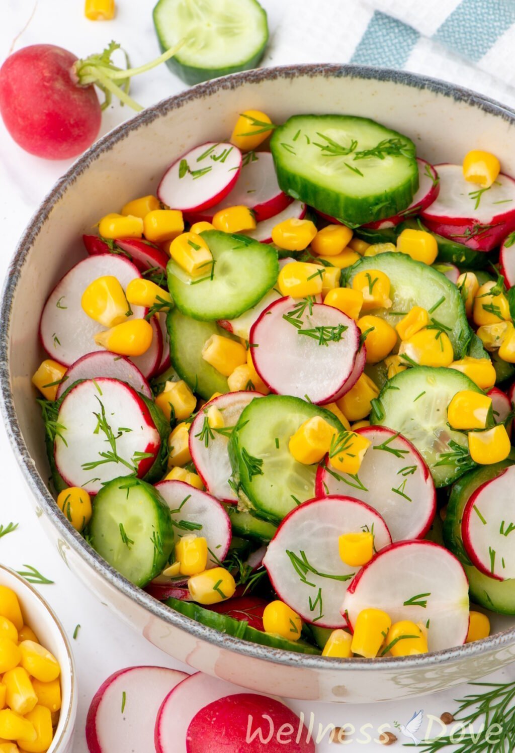 a close up shot of the Fresh Cucumber Summer Vegan Salad in small bowl from a 3/4 angle