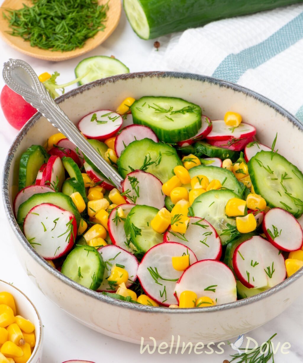 the Fresh Cucumber Summer Vegan Salad in  a small bowl , from a 3/4 angle