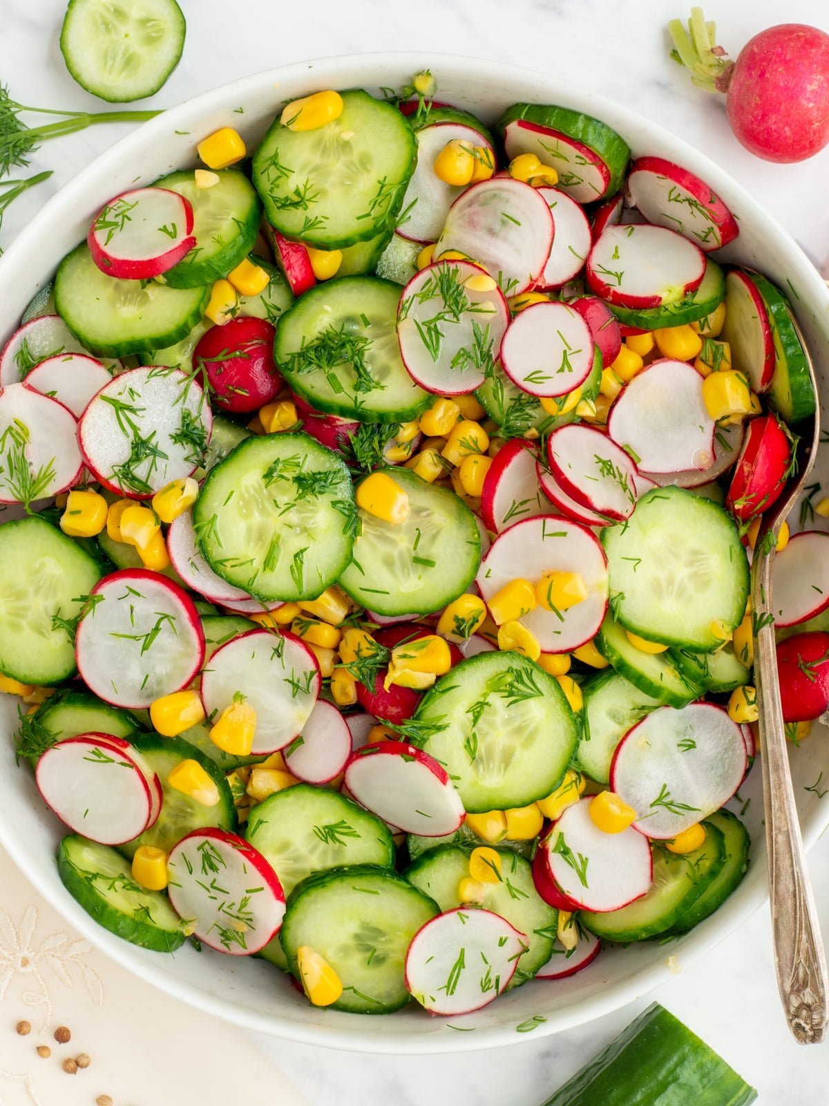 Cucumber salad with radishes and sweetcorn