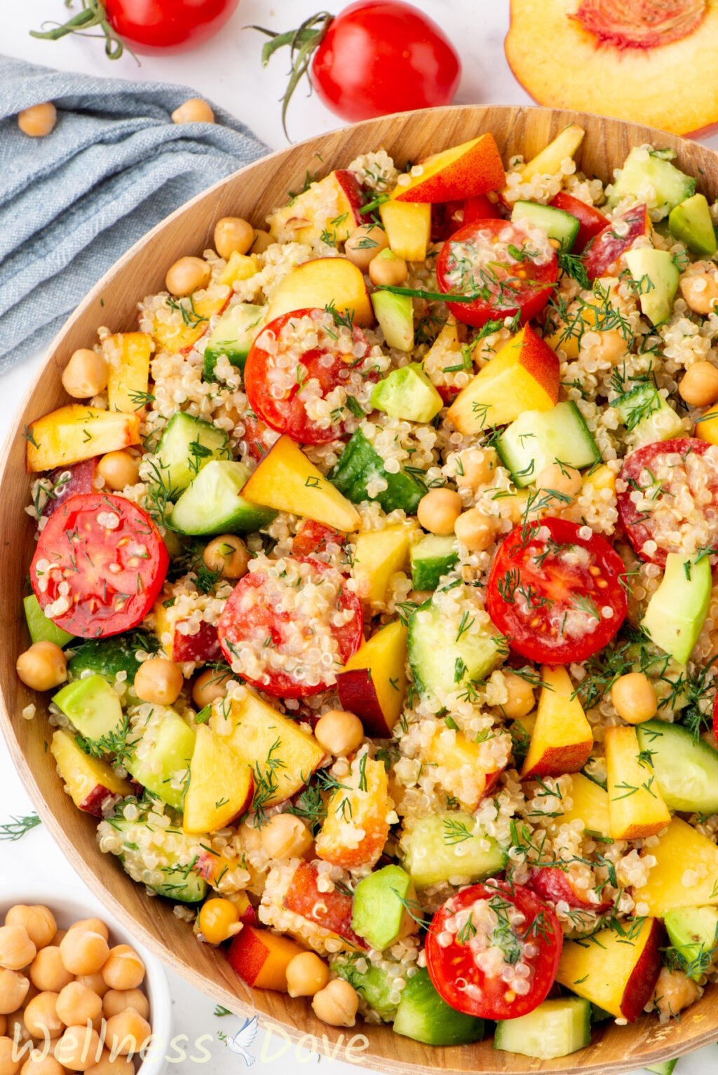 a macro shot of the chickpea quinoa vegan salad in a wooden bowl