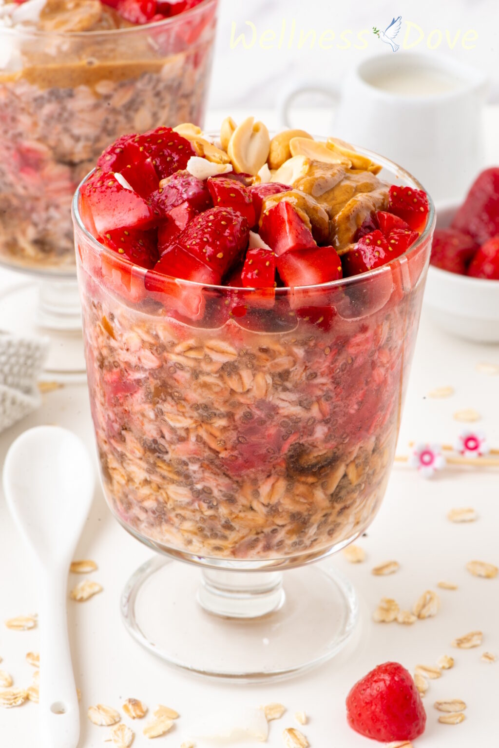 the Easy Overnight Oats with Strawberries in a glass, shot from the side