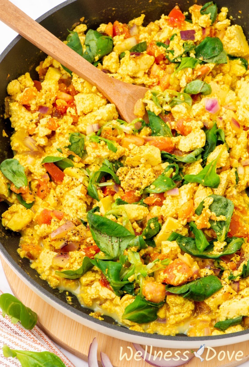 a close up 3/4 photo of the quick curried tofu vegan egg scramble in a pan