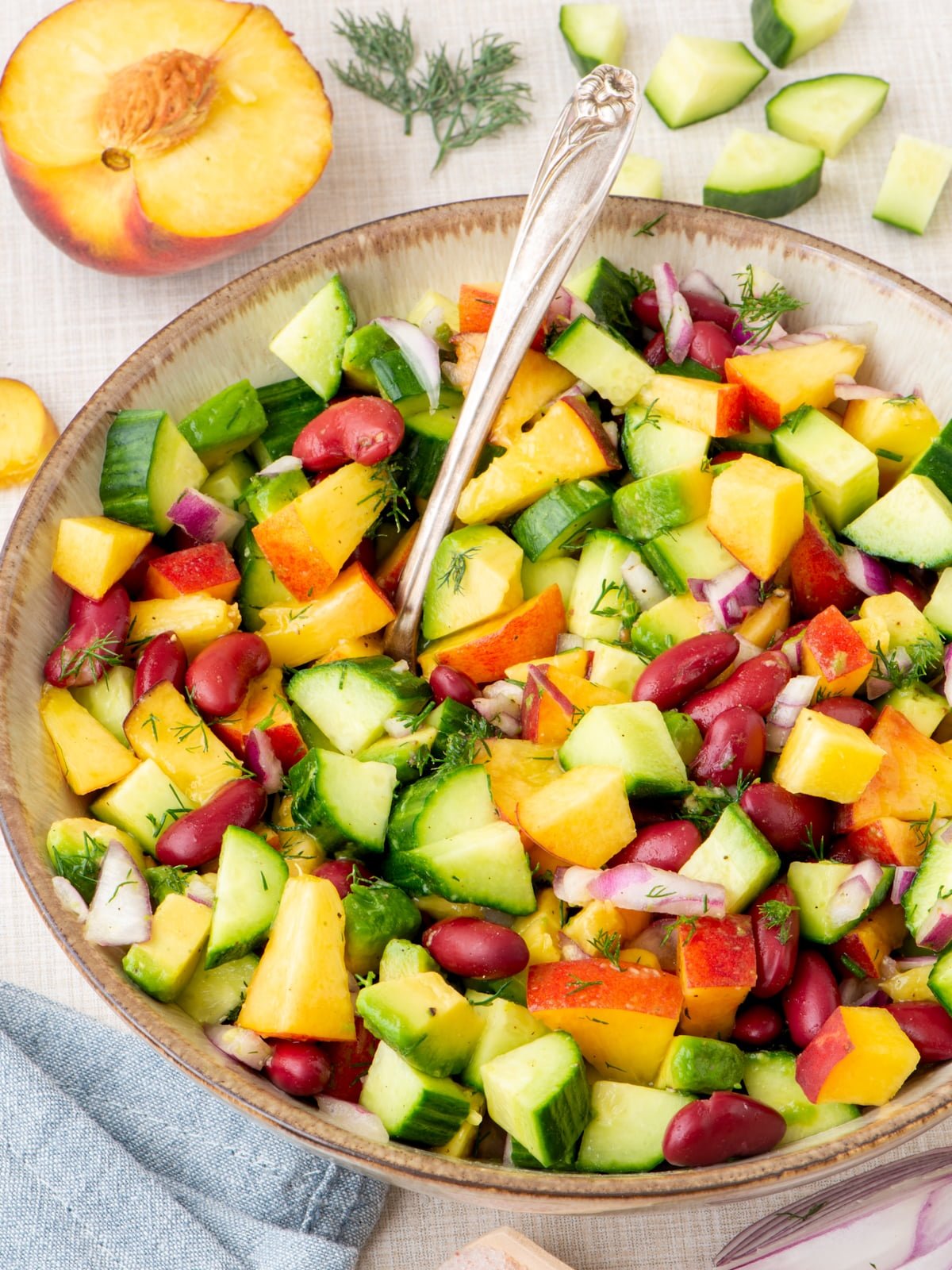 Peach salad with beans, cucumber and avocado