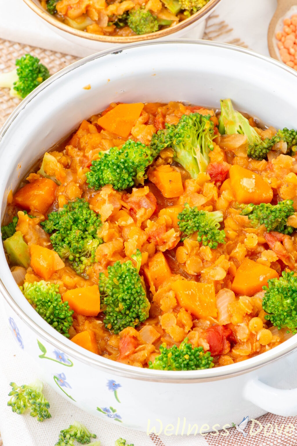 a 3/4 view of the Quick Broccoli Red Lentil Vegan Soup in a small white pot