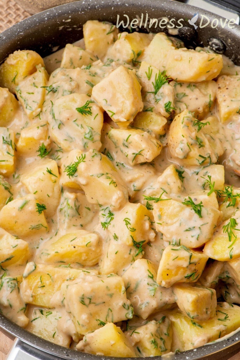 a macro shot of the Garlic Potatoes in a skillet