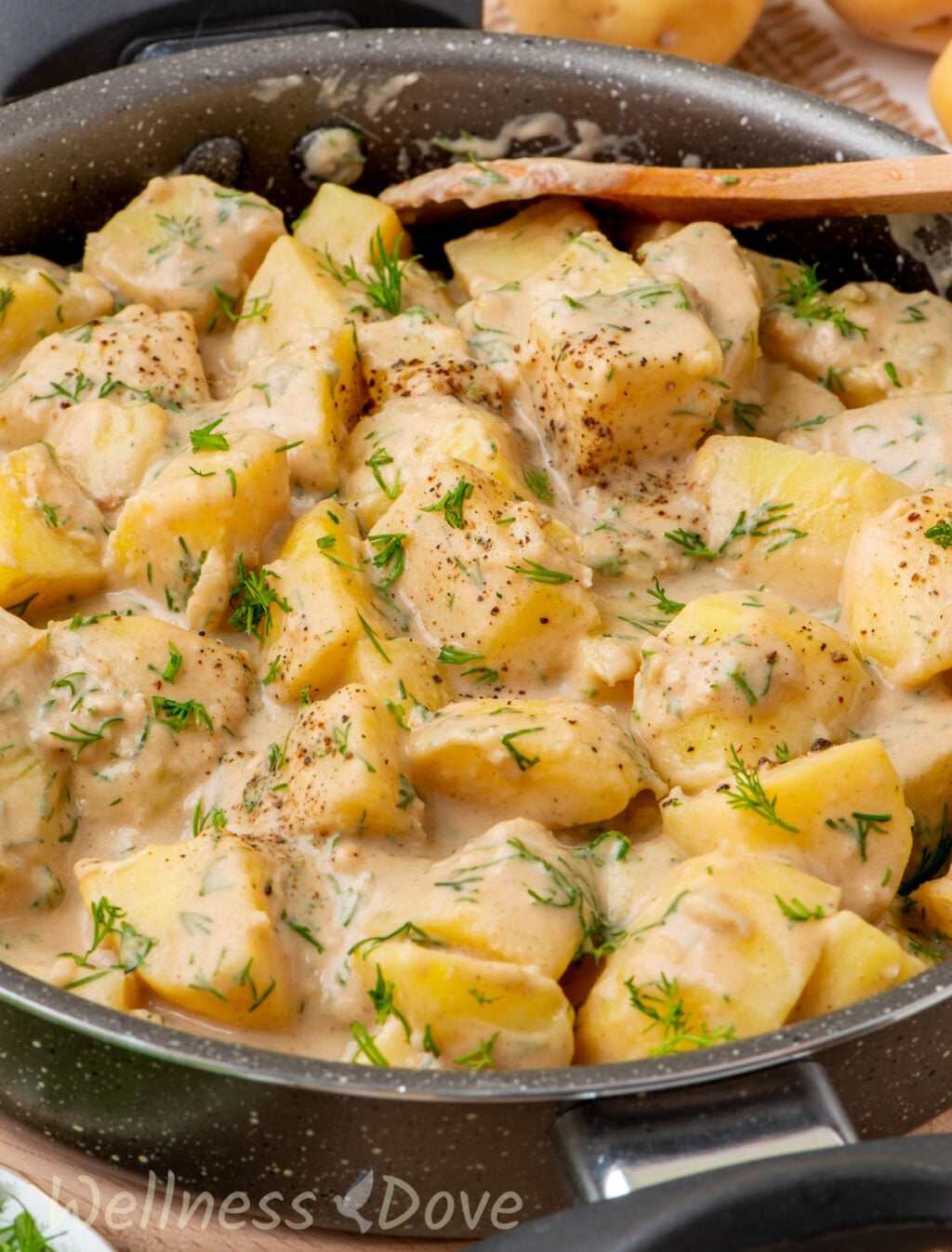 the Garlic Potatoes in a skillet - close up shot from 3/4 angle
