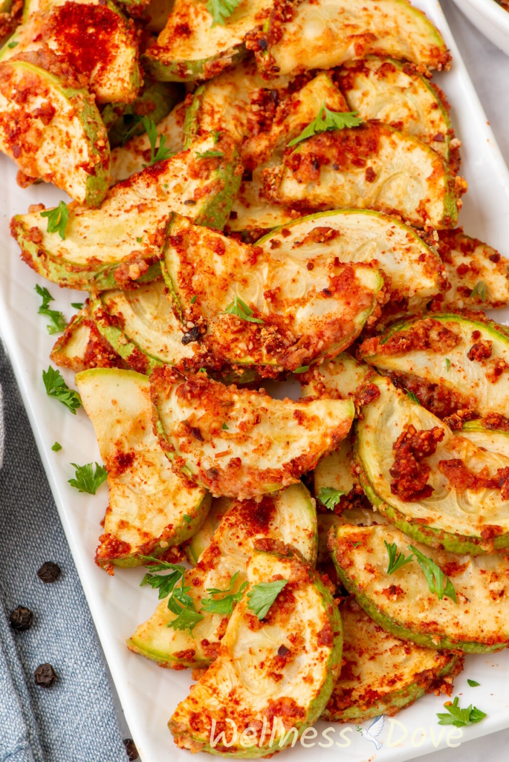 close up shot of the Easy Oil-free Vegan Baked Zucchini in a elongated dish