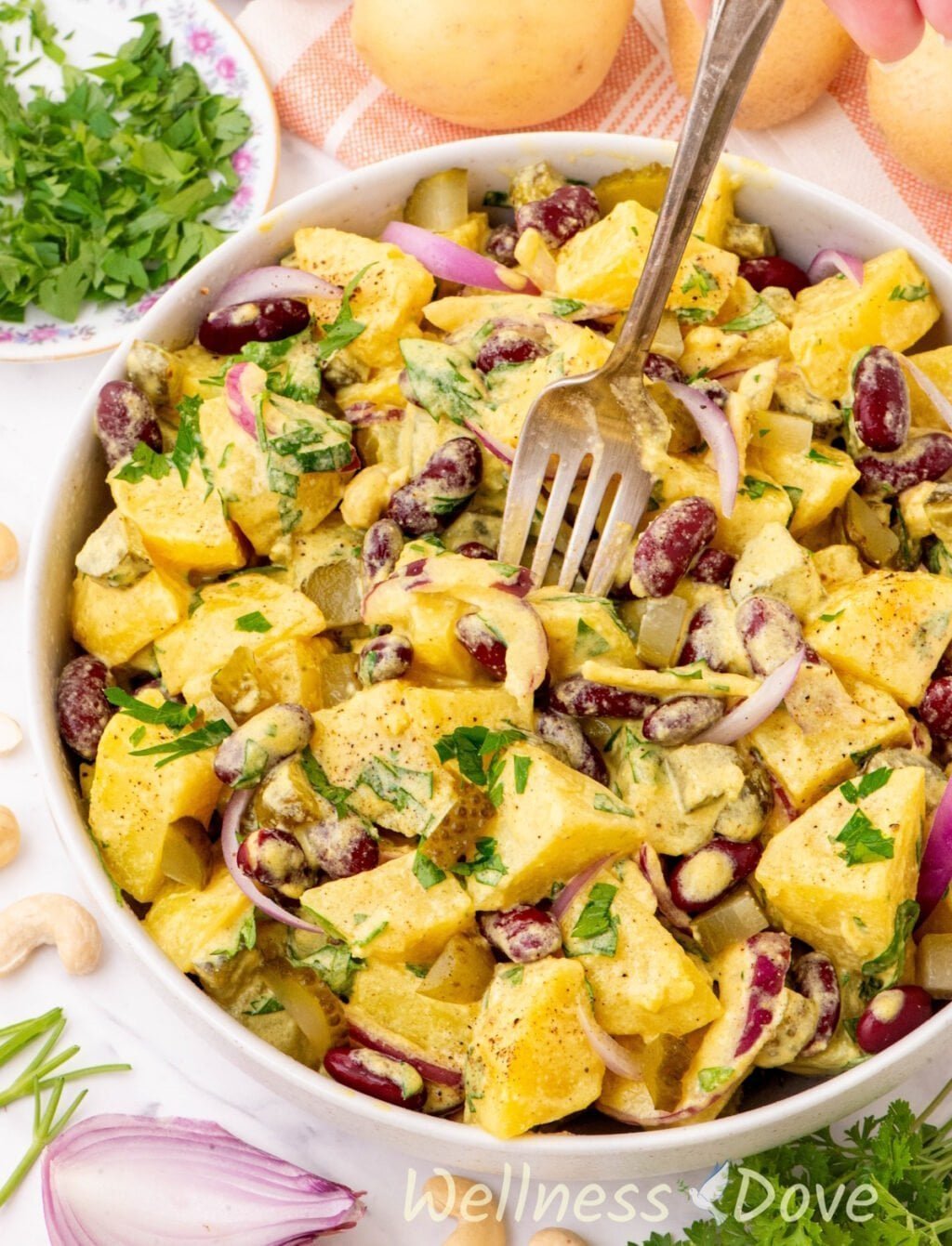 another 3/4 angled photo of the creamy no mayo vegan potato salad in a bowl