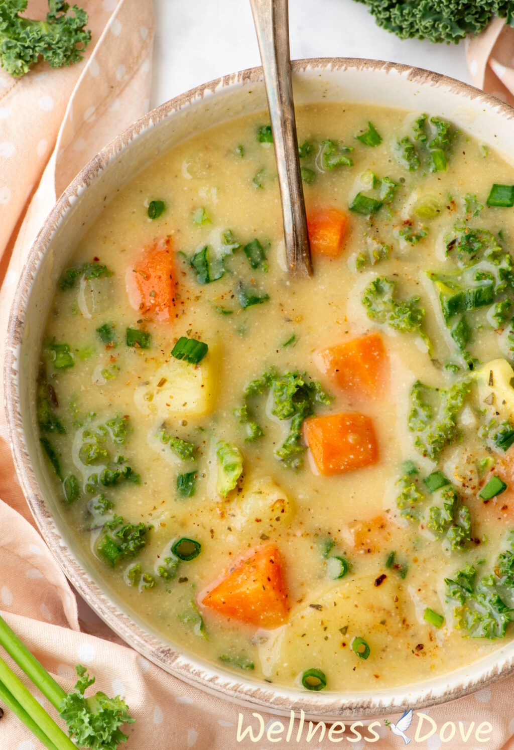 a macro shot of the Creamy Kale Potato Vegan Soup in a bowl