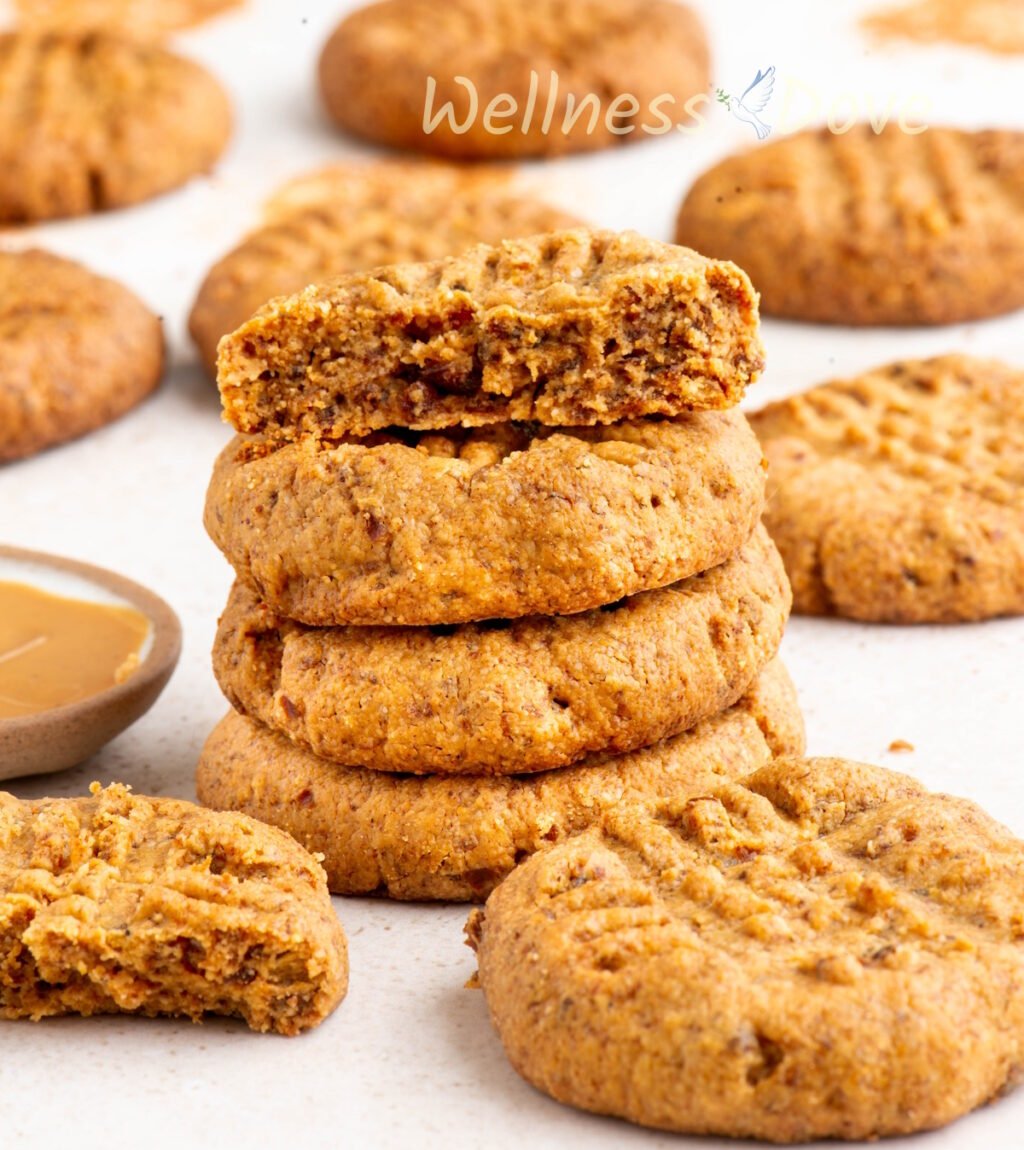 a macro shor of the Easy and Healthy Peanut Butter Vegan Cookies, 4 of them are stacked on top of each other.