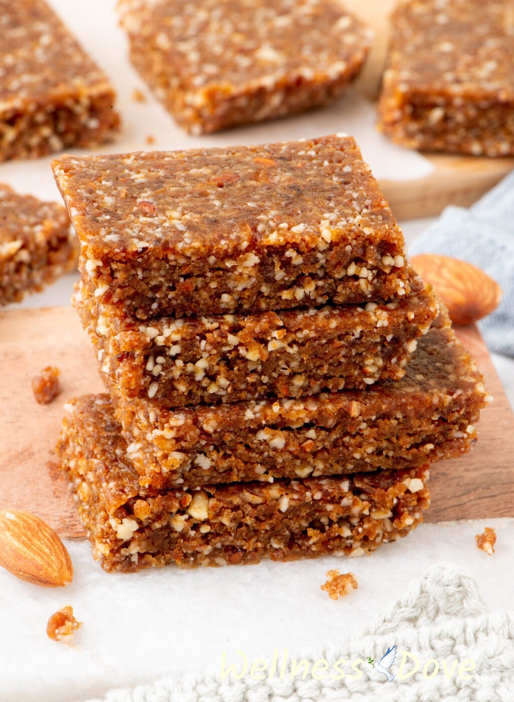 the Almond Peanut Butter Bars stacked on otp of each other.